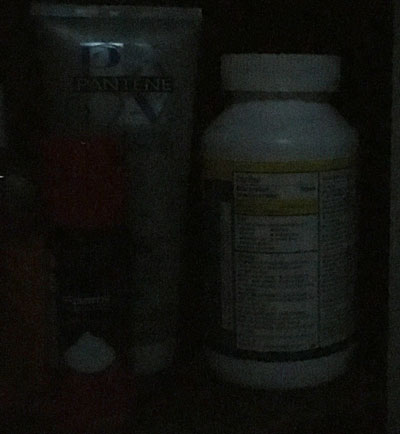 a medicine bottle in the dark