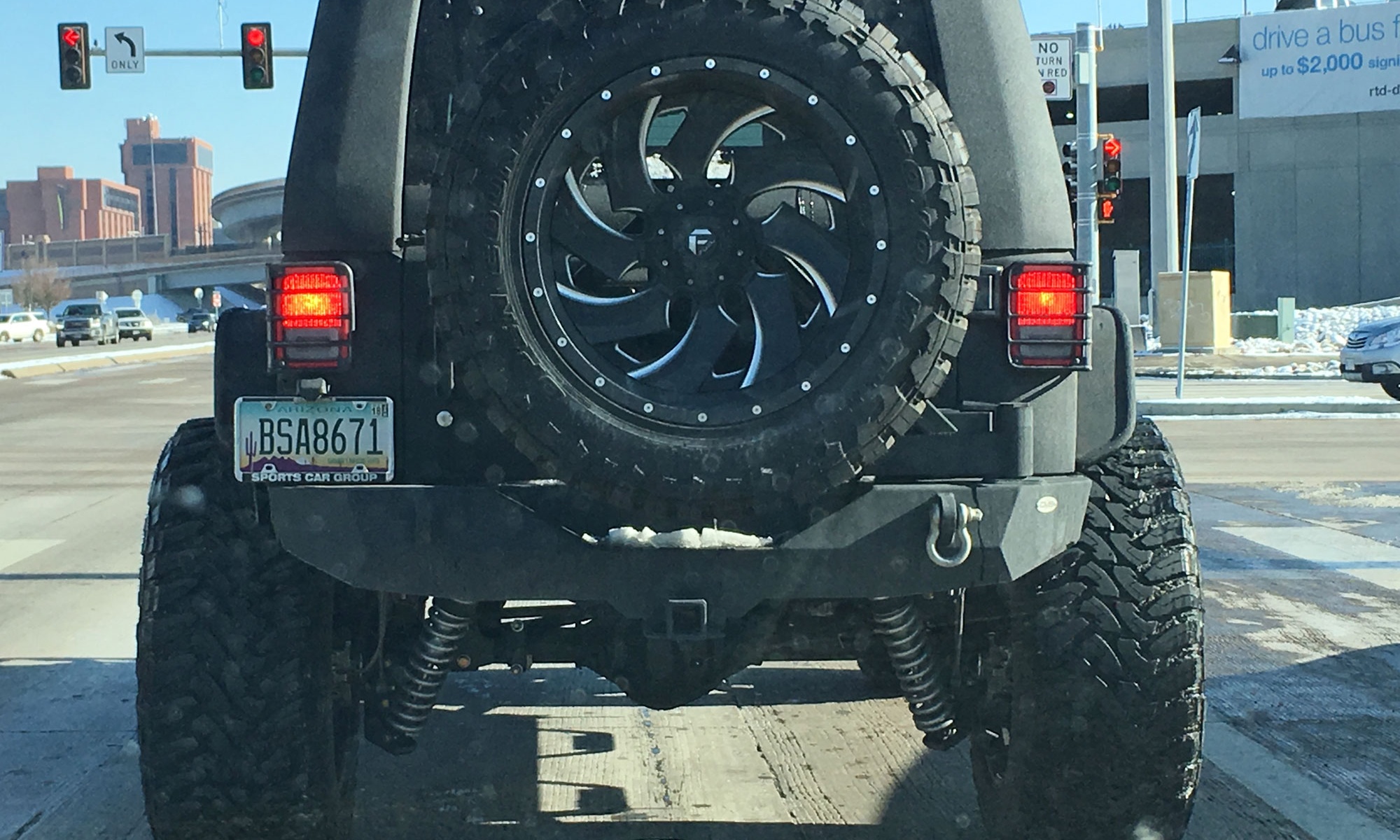 rear view of a Jeep with giant wheels