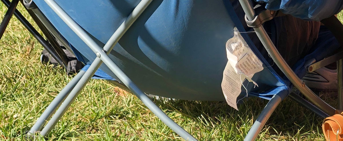 labels hanging off of portable camp chairs