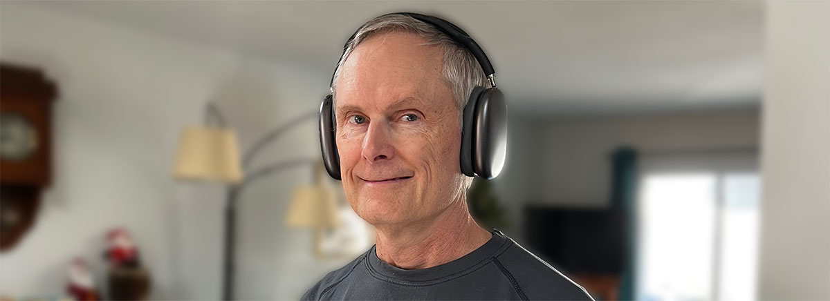 Paul wearing Apple AirPods Max headphones