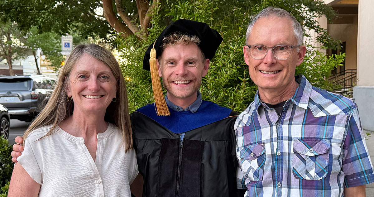 Three of the Merrill family on graduation day, 2026